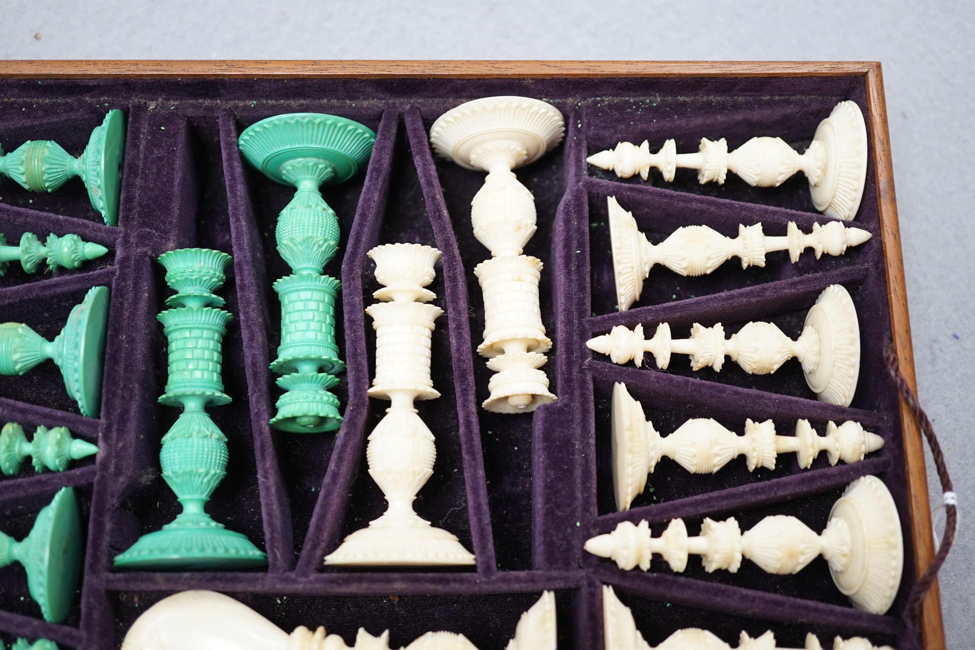 A boxed 19th century Burmese pattern ivory chess set, one pawn restored, king height 11cm